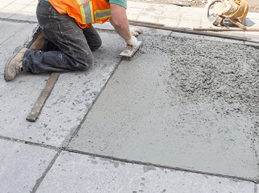 Professional repairing a concrete floor in Chattanooga, TN